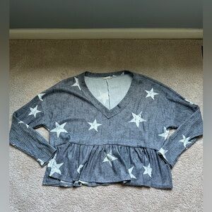 Grey and white star sweater. Super comfy, does run a little big.